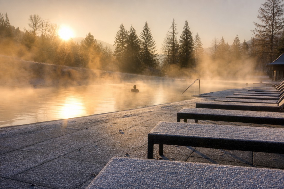 Quiet early morning at a steaming outdoor bath in Budapest in December